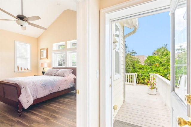 bedroom with access to exterior, vaulted ceiling, and wood finished floors