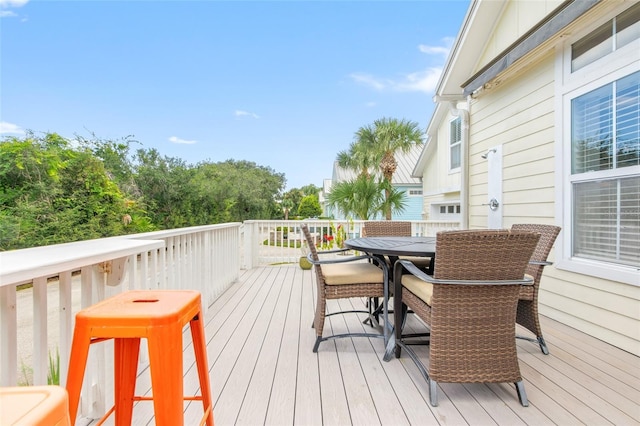 wooden terrace with outdoor dining area