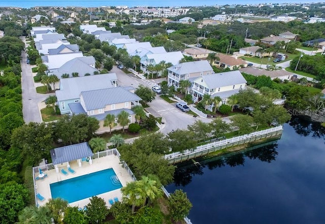 birds eye view of property with a residential view and a water view