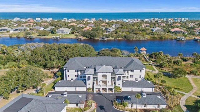 aerial view featuring a water view and a residential view