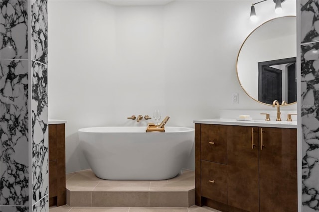 bathroom with a freestanding tub and vanity