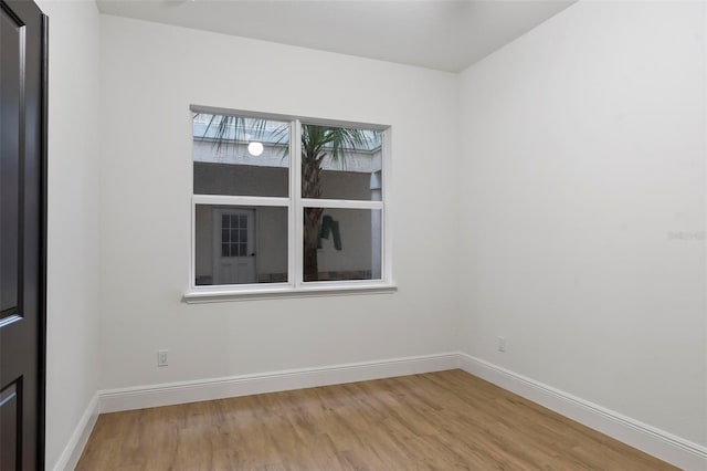 spare room with light hardwood / wood-style floors