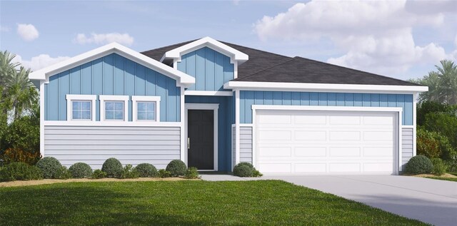 view of front of property featuring a garage and a front yard