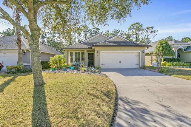 ranch-style house featuring a garage and a front lawn