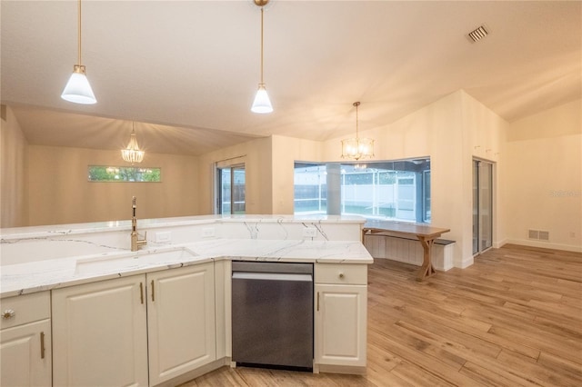 kitchen with pendant lighting, sink, light wood-type flooring, and an inviting chandelier