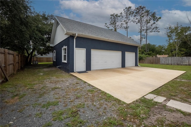 garage with a lawn