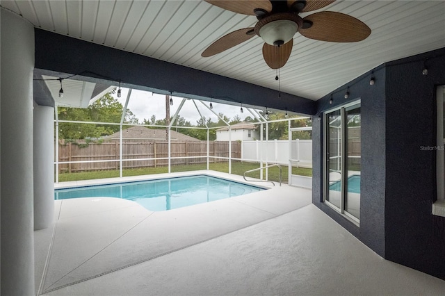 view of pool featuring ceiling fan and a patio area