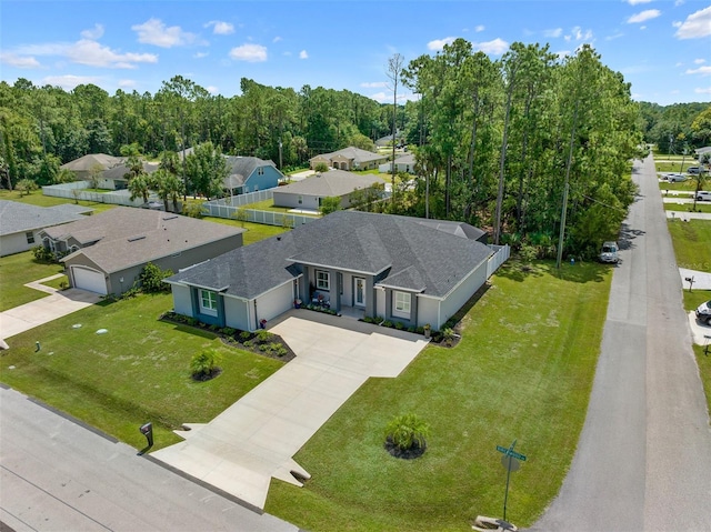 birds eye view of property with a residential view