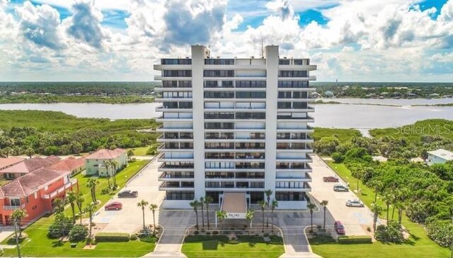 view of building exterior featuring a water view