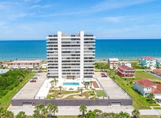 birds eye view of property with a water view