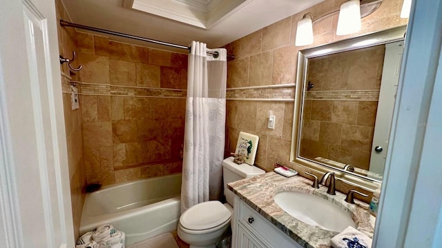 full bathroom featuring toilet, crown molding, vanity, shower / bath combo, and tile walls