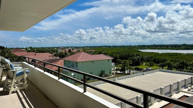 balcony featuring a water view