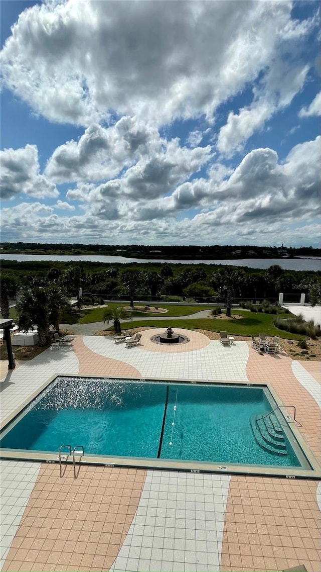 view of swimming pool featuring a patio