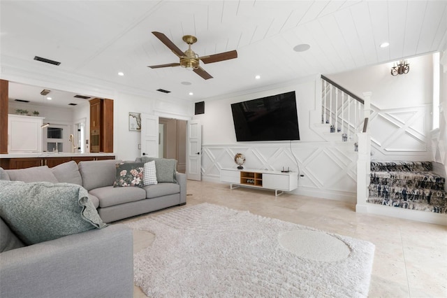 living room featuring ceiling fan and wooden ceiling