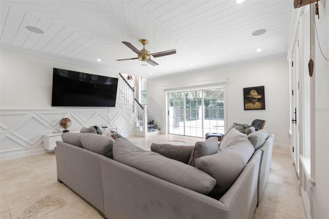 living room with ceiling fan, crown molding, and wooden ceiling