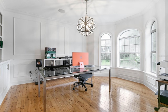 office with crown molding, light hardwood / wood-style floors, and a notable chandelier