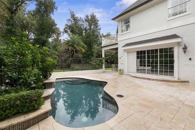 view of swimming pool with a patio