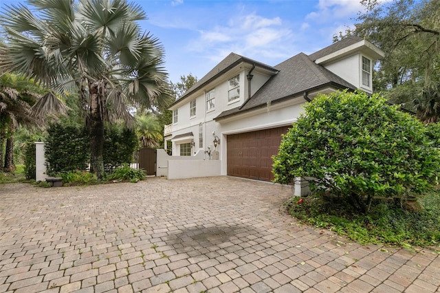 view of side of property with a garage