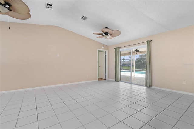 tiled spare room featuring lofted ceiling and ceiling fan