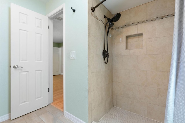 bathroom with hardwood / wood-style floors and curtained shower