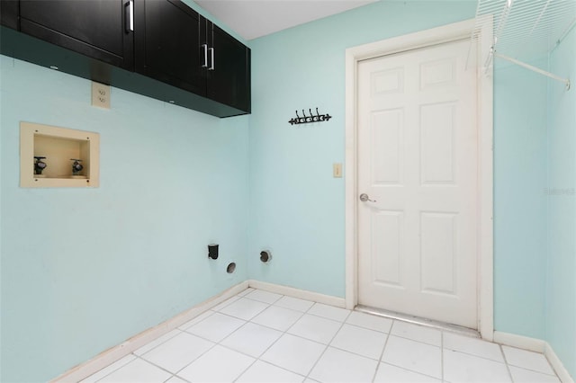 laundry area with hookup for a washing machine, cabinets, light tile patterned floors, and hookup for an electric dryer