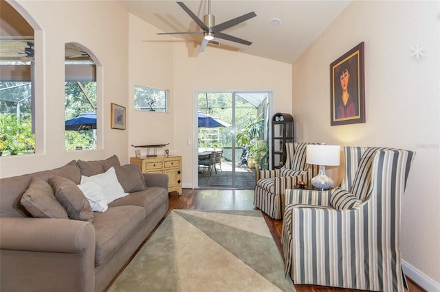 living room with vaulted ceiling, hardwood / wood-style floors, and ceiling fan