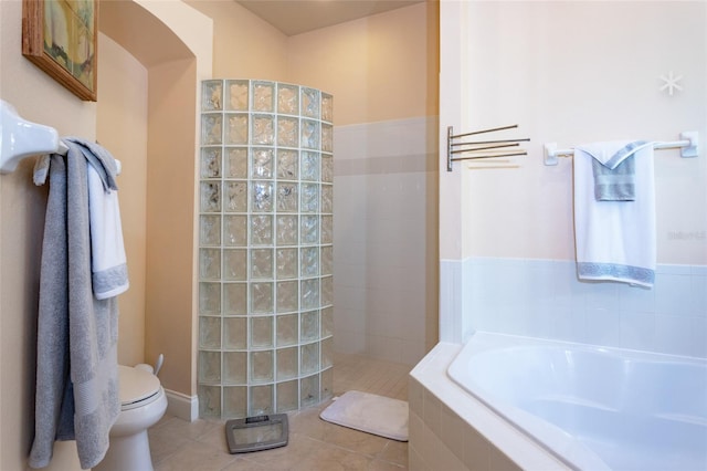 bathroom with toilet, shower with separate bathtub, and tile patterned floors