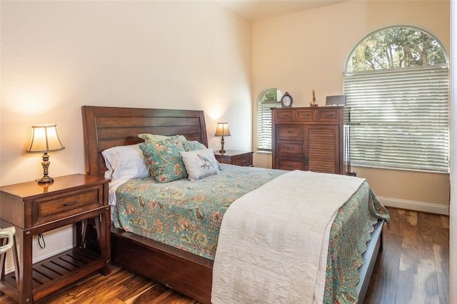 bedroom featuring dark hardwood / wood-style flooring