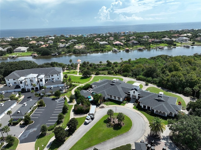 birds eye view of property with a water view