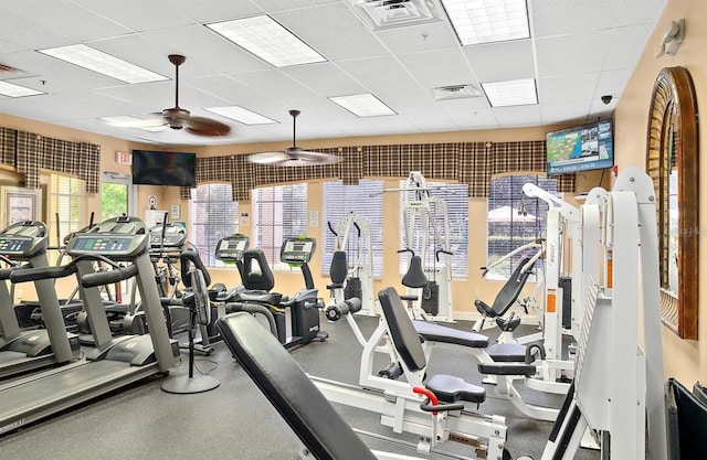 gym featuring a paneled ceiling and ceiling fan