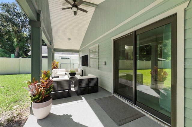 view of patio featuring fence, an outdoor living space, and ceiling fan