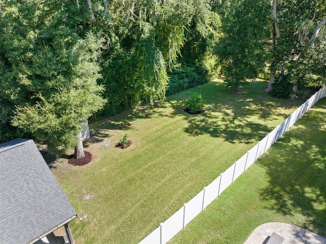 view of yard with a fenced backyard