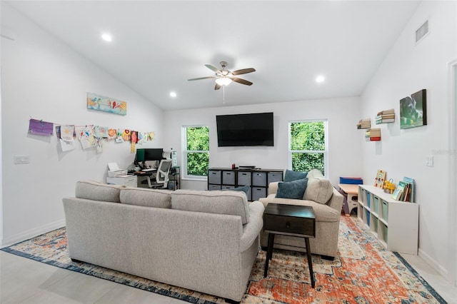 living area featuring lofted ceiling, visible vents, and recessed lighting