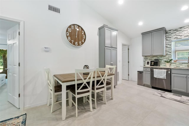 dining area with vaulted ceiling, baseboards, visible vents, and recessed lighting