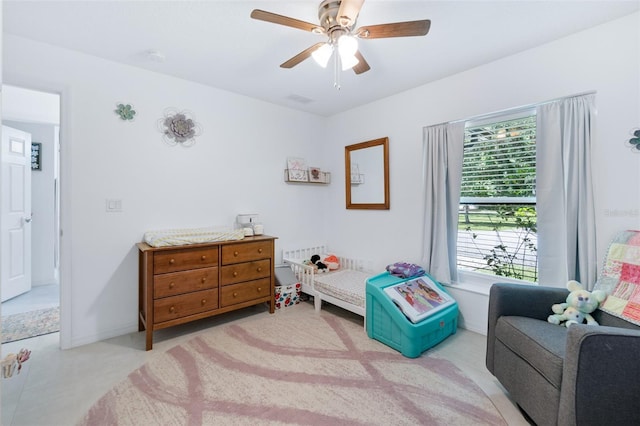 bedroom with baseboards, visible vents, and a ceiling fan