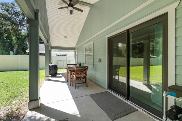 view of patio / terrace featuring ceiling fan and fence