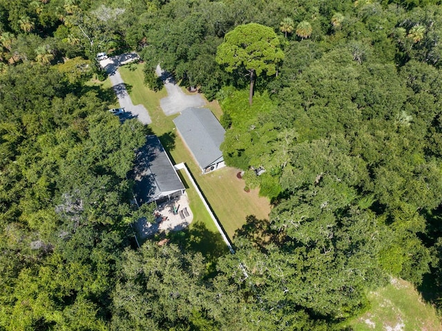 bird's eye view featuring a wooded view