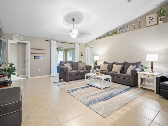 tiled living room featuring ceiling fan and vaulted ceiling