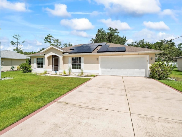 single story home featuring stucco siding, roof mounted solar panels, concrete driveway, and a front lawn