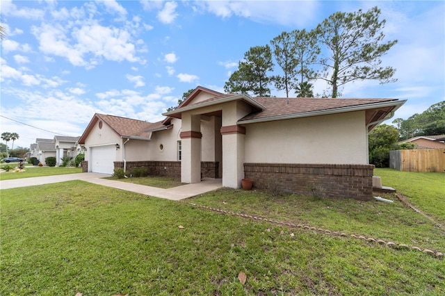 view of front of home featuring a garage and a front yard