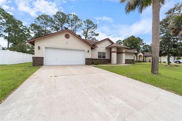 view of front of property featuring a front yard and a garage