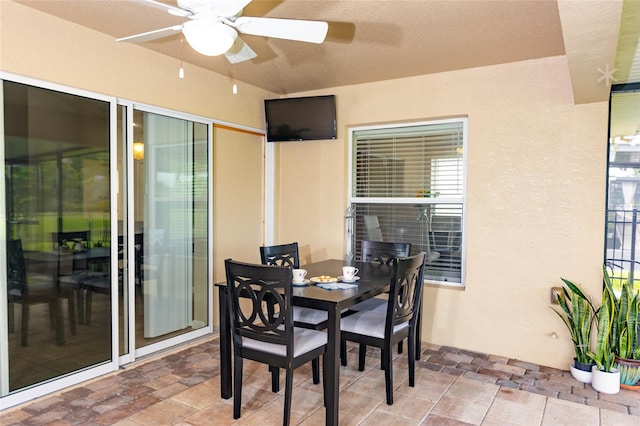 dining room featuring a textured ceiling and ceiling fan