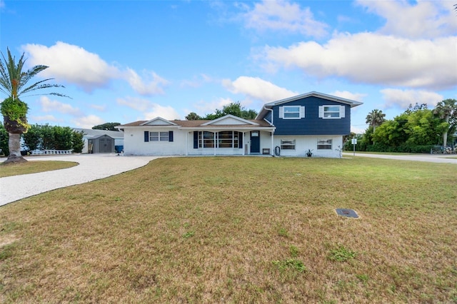 view of front of property featuring a garage and a front yard