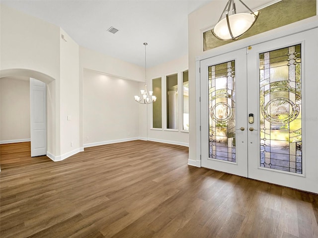 entrance foyer with dark wood-type flooring and french doors