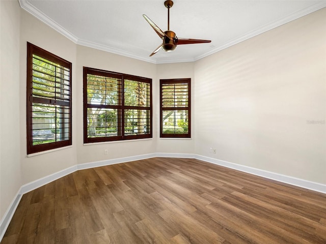 empty room with crown molding, ceiling fan, and hardwood / wood-style flooring