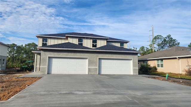 view of front of property with a garage