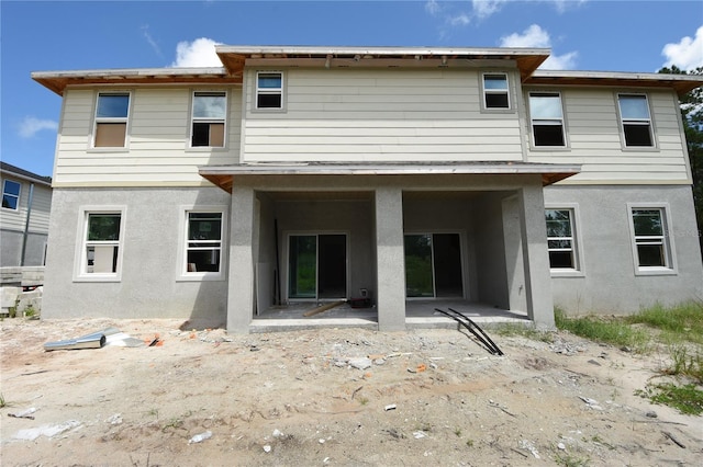 rear view of property with a patio area