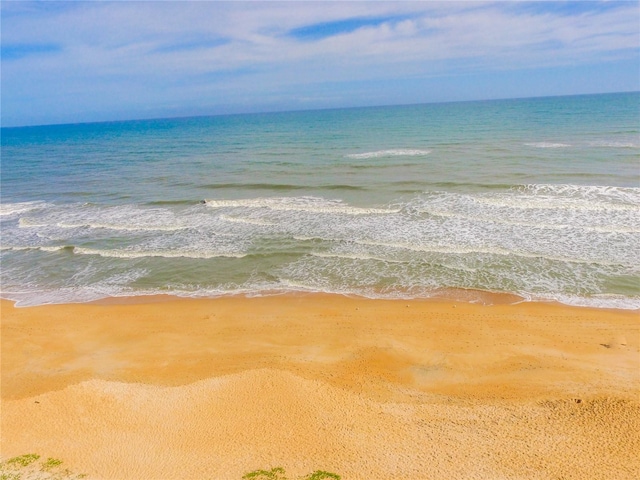 view of water feature with a beach view