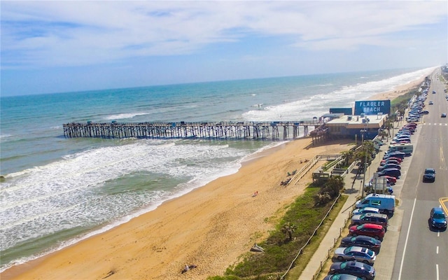 bird's eye view featuring a view of the beach and a water view