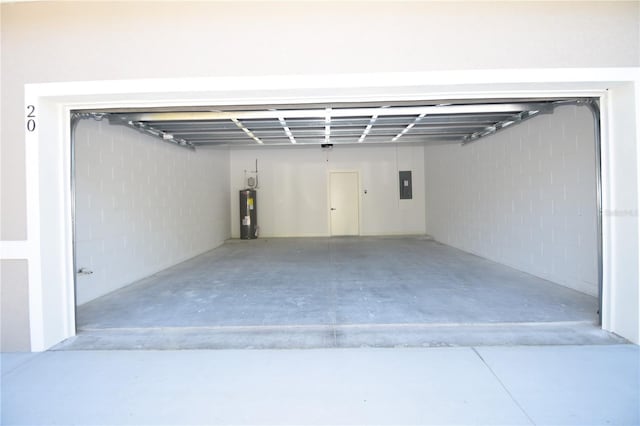 garage with water heater and electric panel